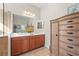 Double vanity bathroom with a large mirror and a walk-in shower at 11422 Griffith Park Ter, Bradenton, FL 34211