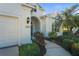 Front entryway with arched doorway and landscaping at 11422 Griffith Park Ter, Bradenton, FL 34211