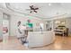 Open concept living area with neutral tones and comfortable furniture at 11422 Griffith Park Ter, Bradenton, FL 34211