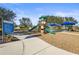 Modern playground with play structures and shaded seating at 11422 Griffith Park Ter, Bradenton, FL 34211