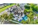 Luxury home with private pool, lush landscaping, and rooftop deck at 171 Mckinley Dr, Sarasota, FL 34236
