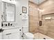 Modern bathroom with white vanity and textured shower walls at 171 Mckinley Dr, Sarasota, FL 34236
