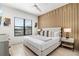 Spacious bedroom with a large bed, light wood floors, and stylish decor at 171 Mckinley Dr, Sarasota, FL 34236