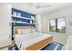 Coastal-themed bedroom with a king bed and blue accent wall at 171 Mckinley Dr, Sarasota, FL 34236