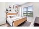 Cozy bedroom with a comfortable bed, natural light, and built-in shelving at 171 Mckinley Dr, Sarasota, FL 34236