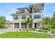 Two-story home with two-car garage, spiral staircase, and landscaped yard at 171 Mckinley Dr, Sarasota, FL 34236