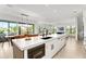 Modern kitchen with white cabinets and a large island at 171 Mckinley Dr, Sarasota, FL 34236
