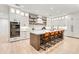Modern kitchen featuring a large island, double oven, and white shaker cabinets at 171 Mckinley Dr, Sarasota, FL 34236