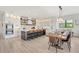 Open concept kitchen with island seating and dining area at 171 Mckinley Dr, Sarasota, FL 34236