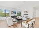 Spacious living area with large TV, comfortable seating, and ample natural light at 171 Mckinley Dr, Sarasota, FL 34236