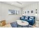 Cozy living room with blue sofa, coffee table, and nautical-themed decor at 171 Mckinley Dr, Sarasota, FL 34236