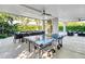 Outdoor patio with pool, ping pong table, and dining area at 171 Mckinley Dr, Sarasota, FL 34236