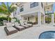 Relaxing lounge area with multiple chairs near the pool and spa at 171 Mckinley Dr, Sarasota, FL 34236