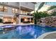 Stunning pool with a waterfall, spa, and outdoor seating area at 171 Mckinley Dr, Sarasota, FL 34236