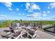 Relaxing rooftop deck with a city view and Adirondack chairs at 171 Mckinley Dr, Sarasota, FL 34236