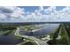 Aerial view of park and lake with bridge at 204 Crew Ct, Sarasota, FL 34243