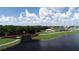 Aerial view of park with lake and walking bridge at 204 Crew Ct, Sarasota, FL 34243
