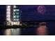 Night view of boathouse with fireworks at 204 Crew Ct, Sarasota, FL 34243