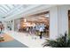 Apple Store in a bright modern mall setting with customers browsing at 204 Crew Ct, Sarasota, FL 34243