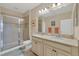 Bathroom boasts double vanity, granite countertop and a shower at 204 Crew Ct, Sarasota, FL 34243