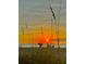 Beach sunset scene with people enjoying the view from beach chairs at 204 Crew Ct, Sarasota, FL 34243
