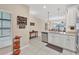 Open concept kitchen with stainless steel appliances and white cabinets at 204 Crew Ct, Sarasota, FL 34243