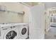 Laundry room with washer, dryer, and shelving at 204 Crew Ct, Sarasota, FL 34243