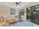 Living room with a comfy sofa, armchairs, and access to a patio at 204 Crew Ct, Sarasota, FL 34243