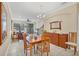 Open living and dining area with hardwood floors, and access to a balcony at 204 Crew Ct, Sarasota, FL 34243