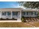 House with gray siding, white trim, and a covered porch at 25413 Prada Dr, Punta Gorda, FL 33955