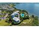 Aerial view of The Beach Club, showcasing the clubhouse, pool, and waterfront location at 311 Compass Point Dr # 201, Bradenton, FL 34209