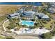 Aerial view showcases The Beach Club's expansive amenities including a large pool and multiple buildings at 311 Compass Point Dr # 201, Bradenton, FL 34209