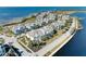 Community overview featuring waterfront homes and landscaping at 311 Compass Point Dr # 201, Bradenton, FL 34209