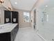 Bathroom with double vanity, large shower, and separate toilet at 311 Compass Point Dr # 201, Bradenton, FL 34209