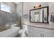 Modern bathroom with a walk-in shower, single vanity, and granite countertop at 311 Compass Point Dr # 201, Bradenton, FL 34209