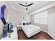 Spacious bedroom with hardwood floors, a ceiling fan, and plenty of natural light at 311 Compass Point Dr # 201, Bradenton, FL 34209