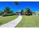 Attractive community entrance with lush landscaping and a welcoming walkway at 311 Compass Point Dr # 201, Bradenton, FL 34209