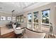 Elegant dining area with water views and modern light fixture at 311 Compass Point Dr # 201, Bradenton, FL 34209