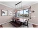 Modern dining room with water views and a stylish light fixture at 311 Compass Point Dr # 201, Bradenton, FL 34209