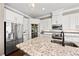 Modern kitchen boasts stainless steel appliances and white cabinetry at 311 Compass Point Dr # 201, Bradenton, FL 34209