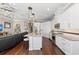 Modern kitchen with white cabinets, granite countertops, and stainless steel appliances at 311 Compass Point Dr # 201, Bradenton, FL 34209