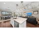 Open concept kitchen and living area with an island and high ceilings at 311 Compass Point Dr # 201, Bradenton, FL 34209