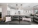 Elegant living room with a large sectional sofa and adjacent kitchen at 311 Compass Point Dr # 201, Bradenton, FL 34209