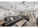 Open concept living room with high ceilings, sectional sofa, and kitchen views at 311 Compass Point Dr # 201, Bradenton, FL 34209