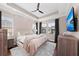 Spacious main bedroom with large TV and cozy bedding at 311 Compass Point Dr # 201, Bradenton, FL 34209