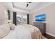 Main bedroom with a large TV and water views at 311 Compass Point Dr # 201, Bradenton, FL 34209