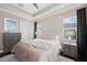 Main bedroom with plush bedding and ample dresser space at 311 Compass Point Dr # 201, Bradenton, FL 34209