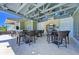 Outdoor kitchen and dining area with bar seating and grills at 311 Compass Point Dr # 201, Bradenton, FL 34209