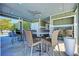 Comfortable seating area near the pool with tables and chairs at 311 Compass Point Dr # 201, Bradenton, FL 34209