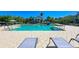 Inviting resort-style pool with plenty of lounge chairs for sunbathing at 311 Compass Point Dr # 201, Bradenton, FL 34209